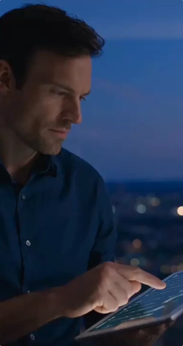 Cybersecurity professional reviewing data on a tablet